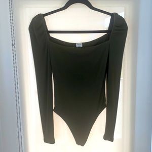 Body suite, low front and back. Square neckline. Stretchy material